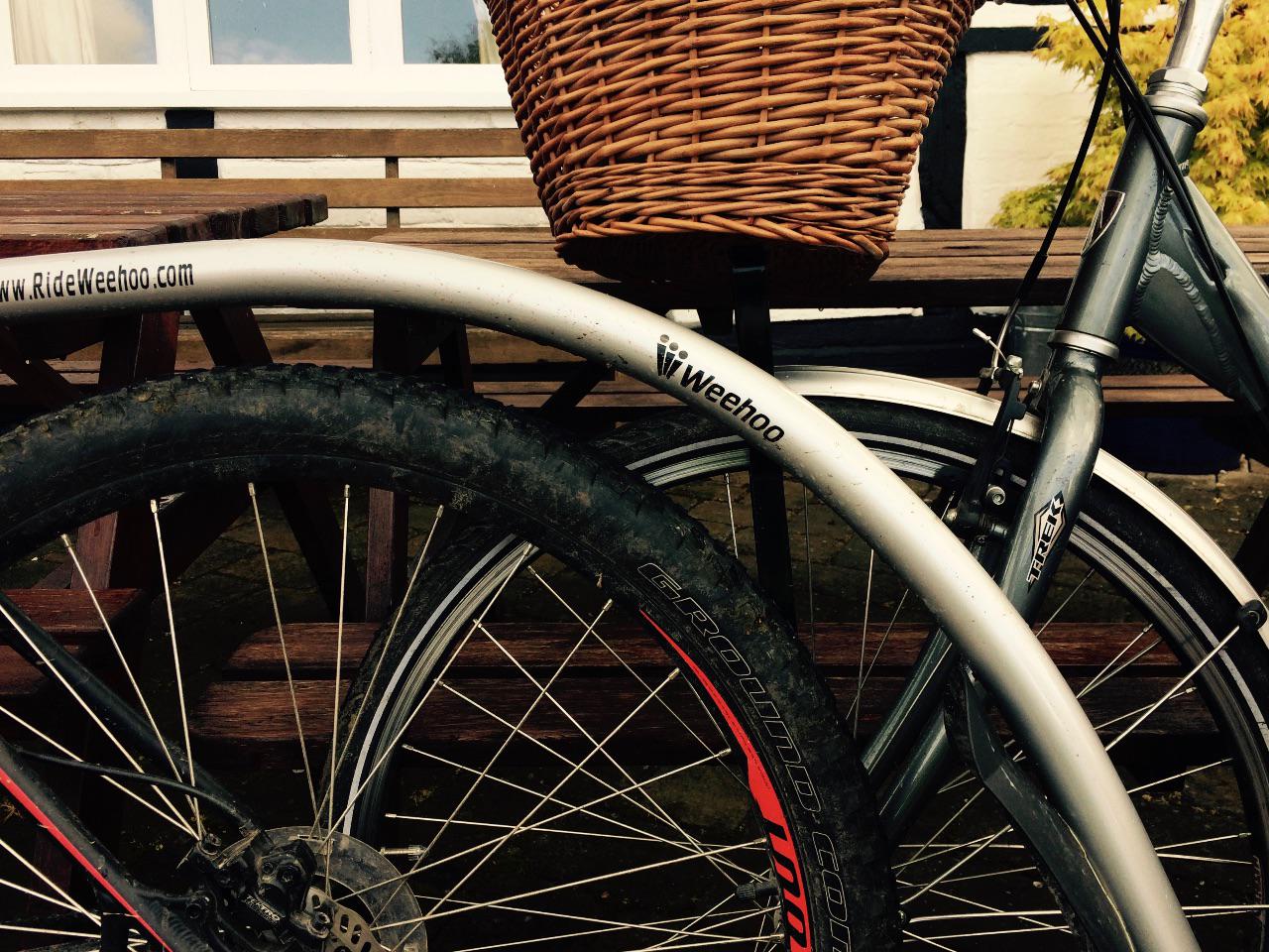 Bikes and trailer lean on a bench during a pub stop on the return from Gloucester Docks.